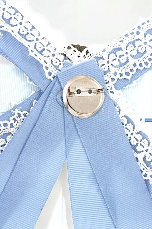 ANTIQUE FRAMED BLUE BOW BROOCH