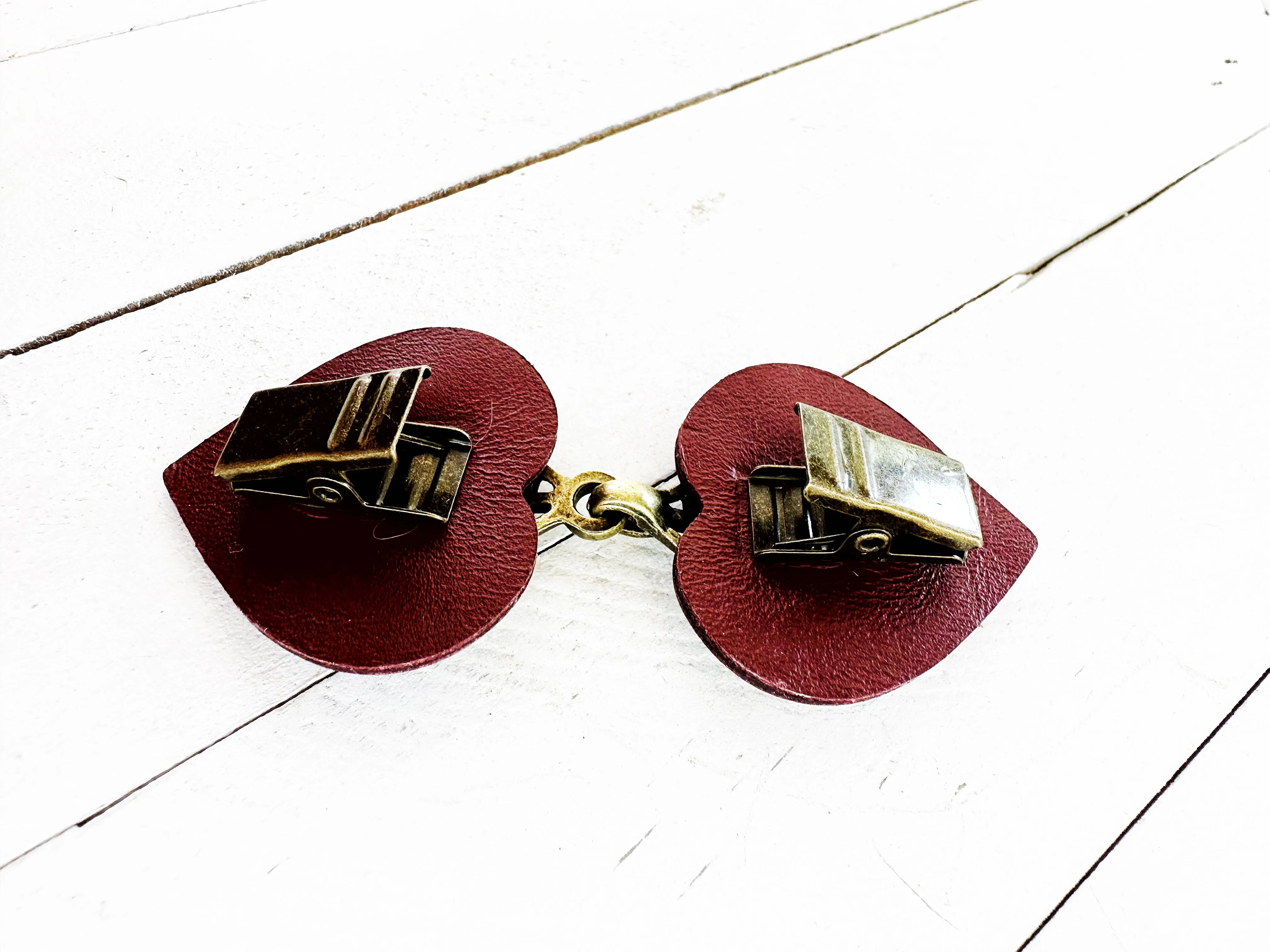 Dress Clip -Myriad Bronze on Dark Red Leather