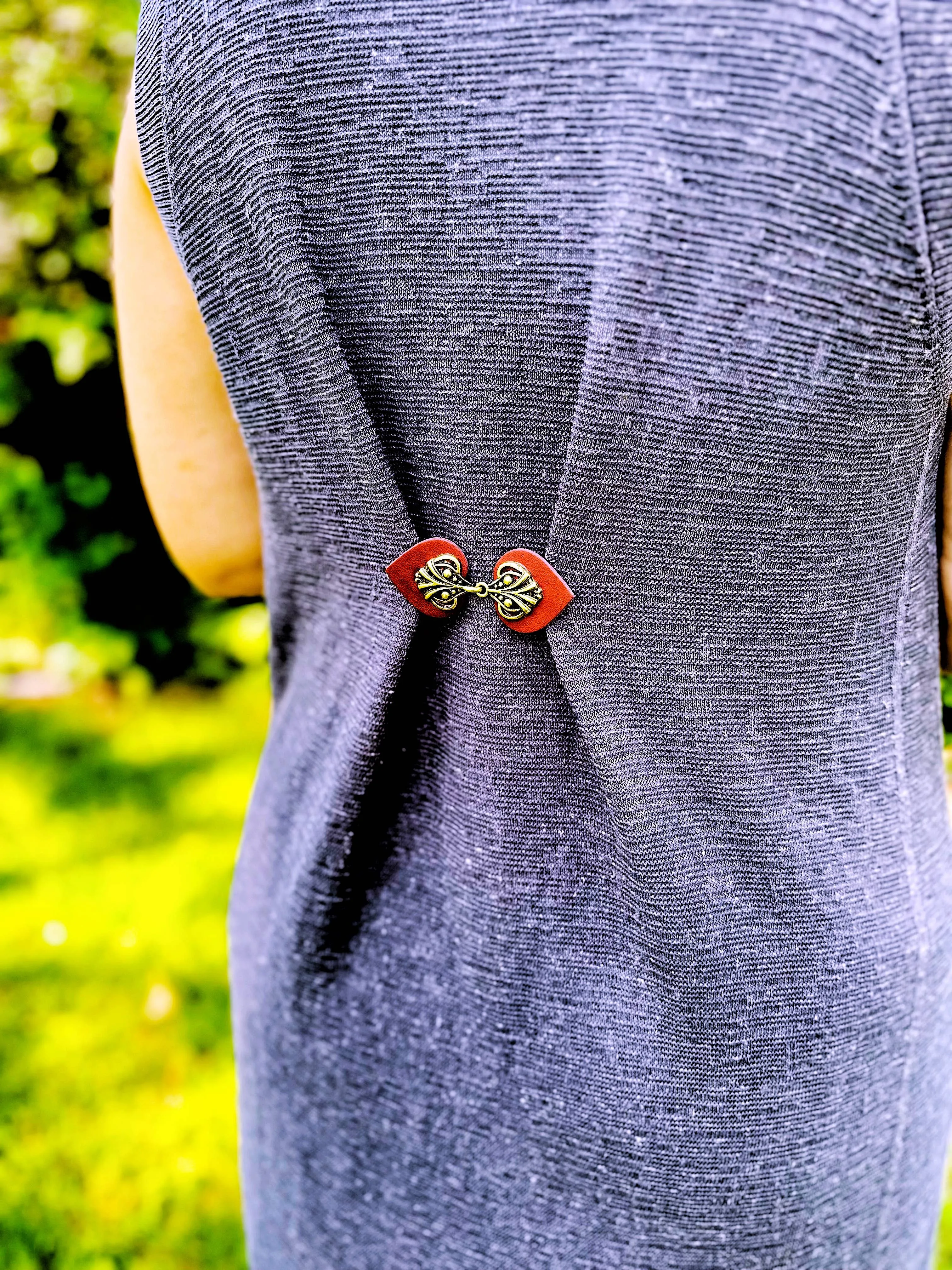 Dress Clip -Myriad Bronze on Dark Red Leather