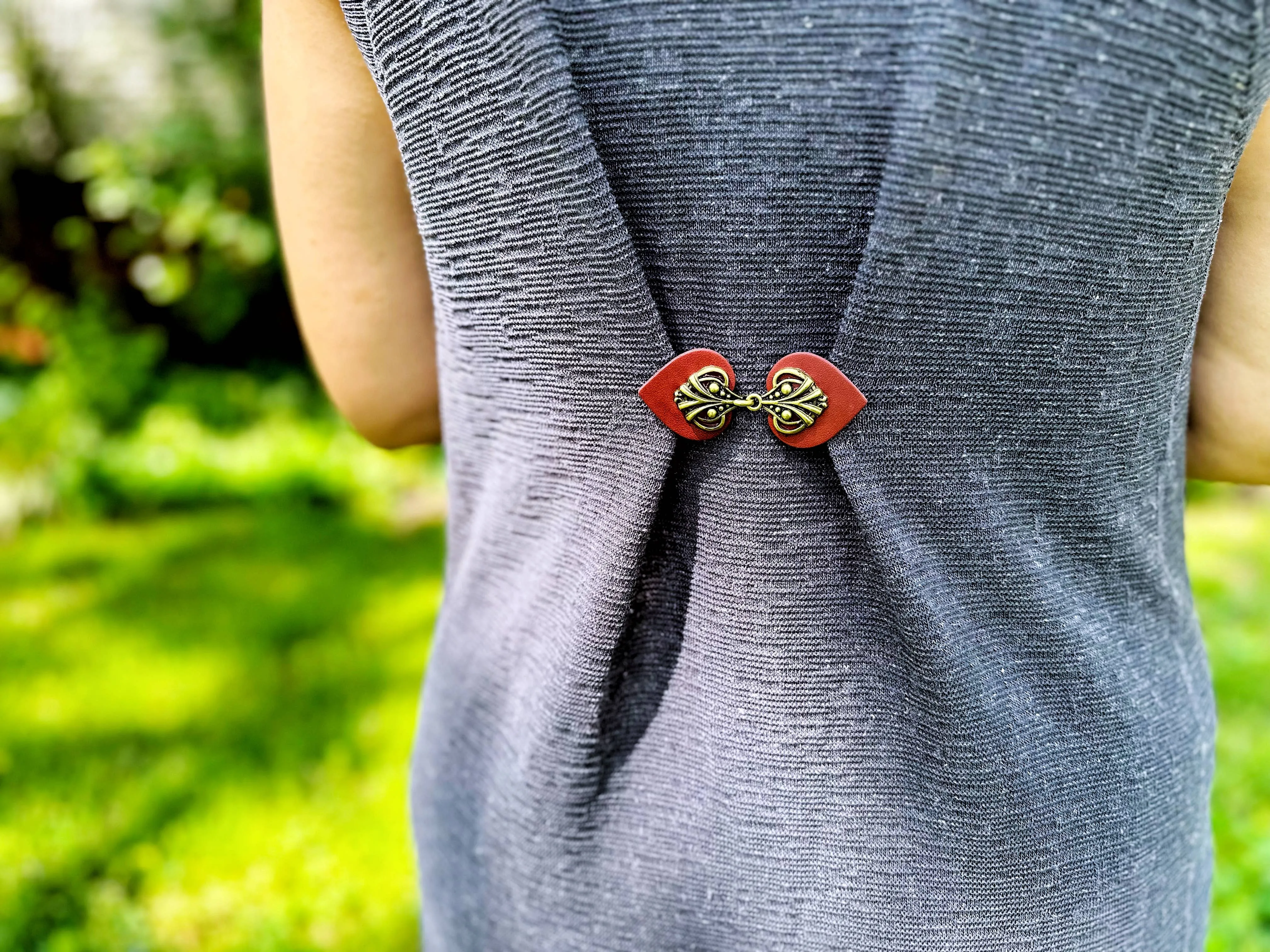 Dress Clip -Myriad Bronze on Dark Red Leather