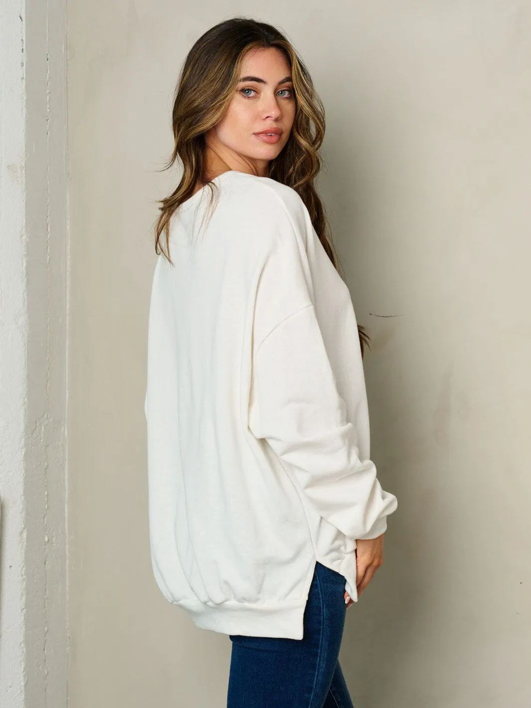 WOMEN'S LONG SLEEVE GRAPHIC SWEATER